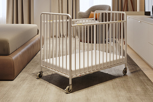 StowAway folding metal crib offers a traditional steel appeal