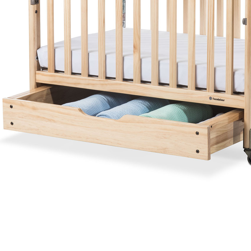 Crib with bottom drawer top