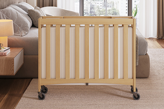 Travel Sleeper Mini Crib easily folds for space saving storage