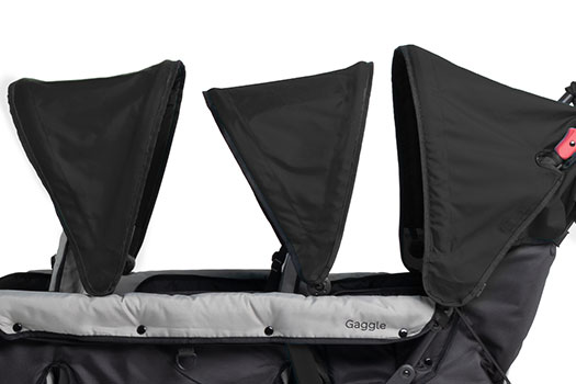 Compass trio stroller has three seats each with their own sun canopy